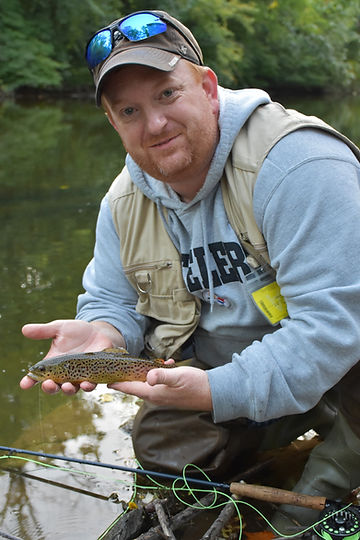 Ralph Scherder holding a brown trout