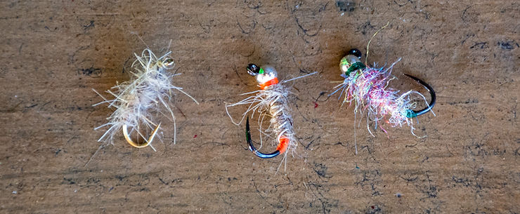Walt's Worm on left, an orange Sexy Walt in the middle, and a Sexy Walt tied with Rainbow Scud Dubbing on the right