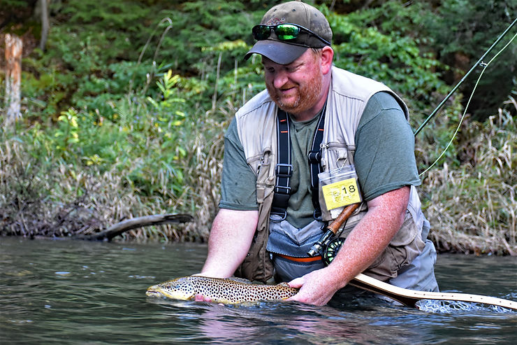 Ralph releasing a brown trout