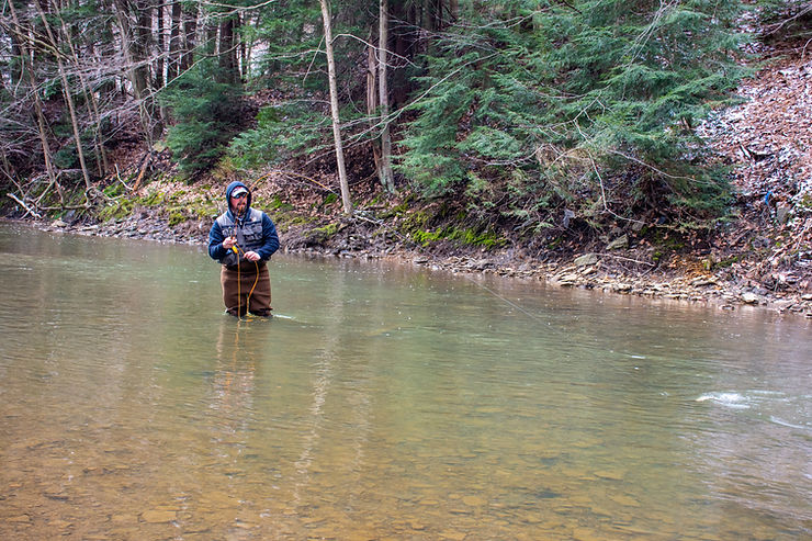 Greg fly-fishing down stream