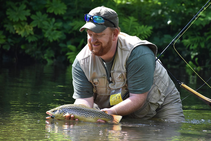 Ralph Scherder catching a brown trout