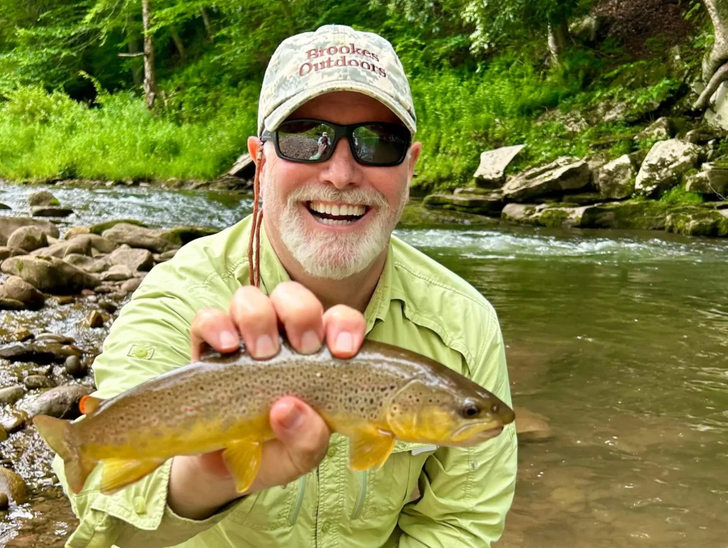 man holding brown trout