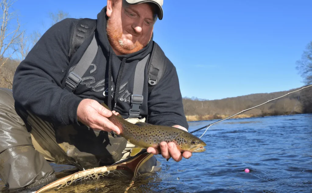 angler holding trout