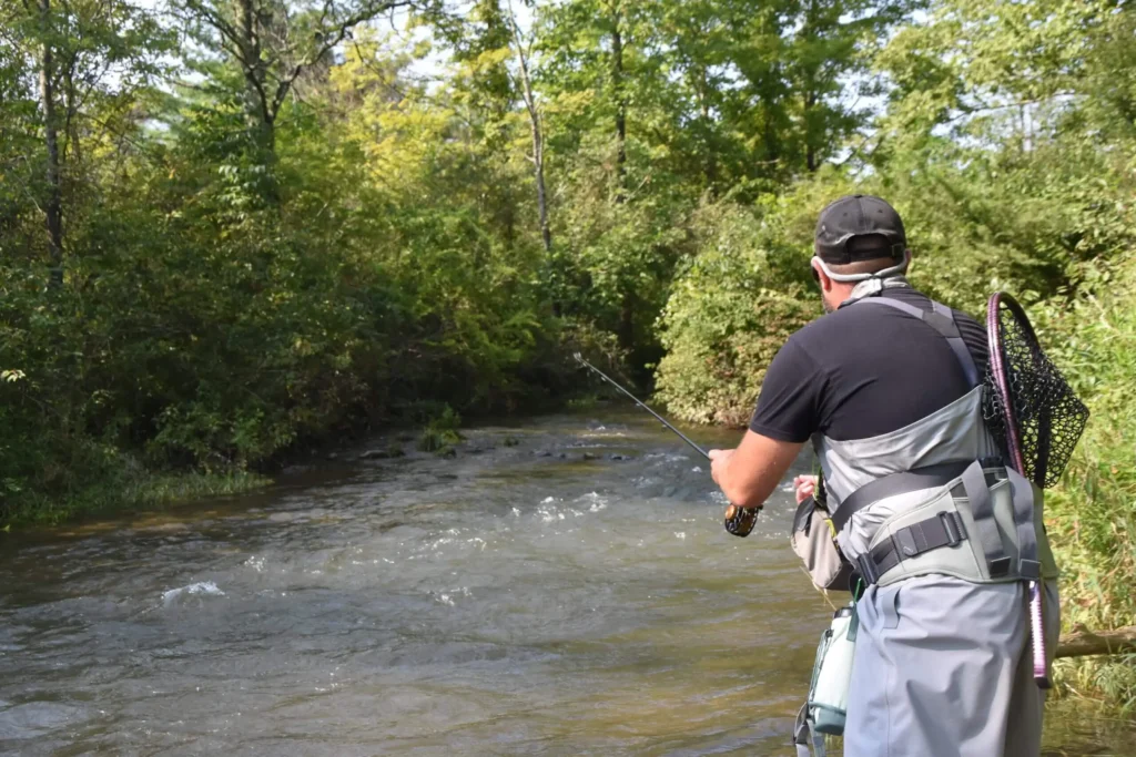 man fishing a stream