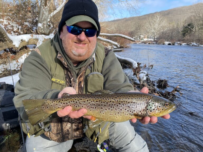 man holding a trout