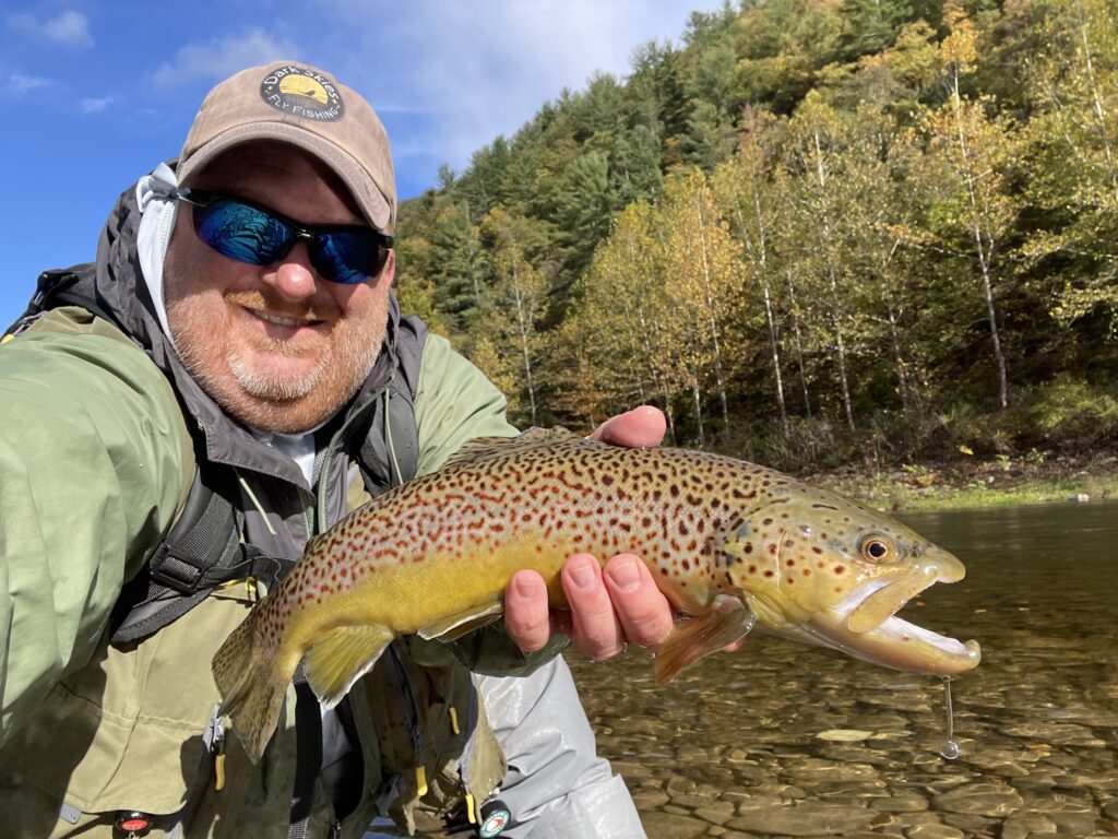 man holding brown trout