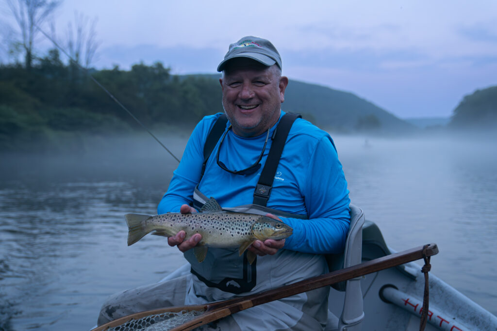 Beau Beasley with a brown trout on the Delaware River.