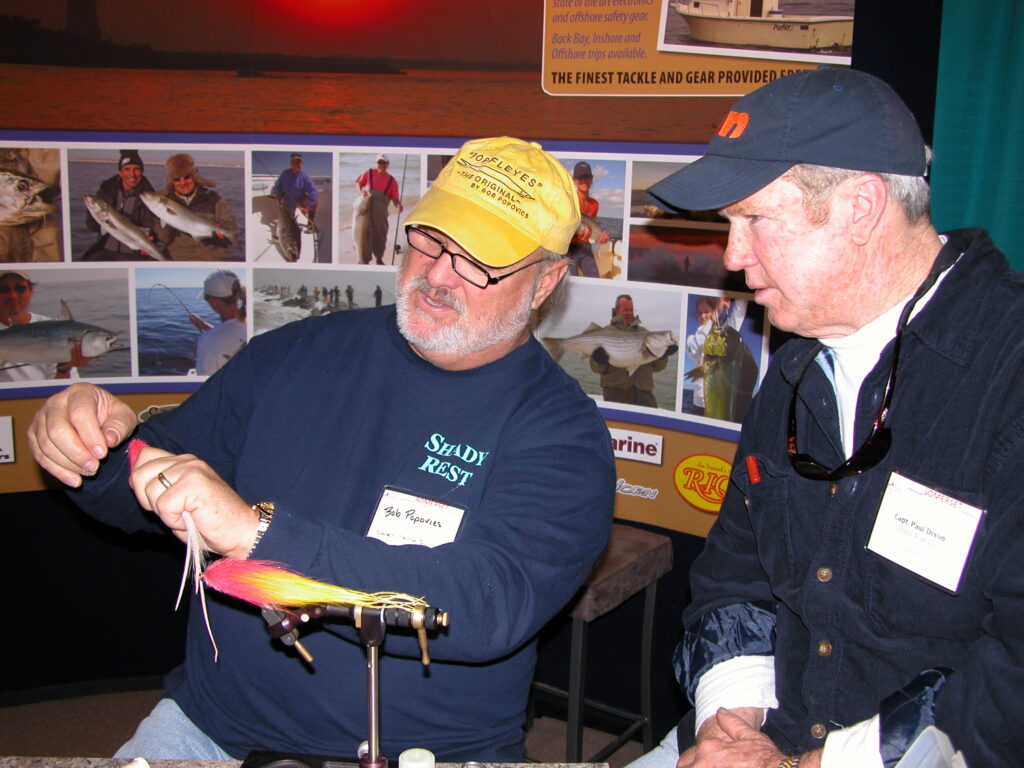 two men tying flies